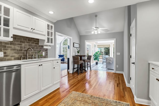 2707 Waterpointe Cir, Mount Pleasant, SC 29466 - kitchen featuring stainless steel dishwasher, a sink, light countertops, a ceiling fan, and vaulted ceiling