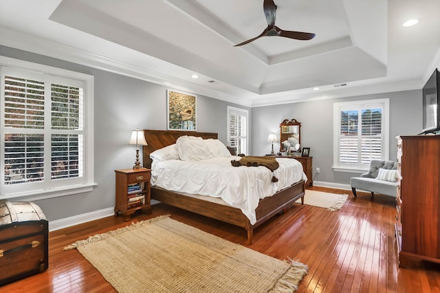 2707 Waterpointe Cir, Mount Pleasant, SC 29466 - bedroom featuring a raised ceiling, wood-type flooring, baseboards, a ceiling fan, and recessed lighting