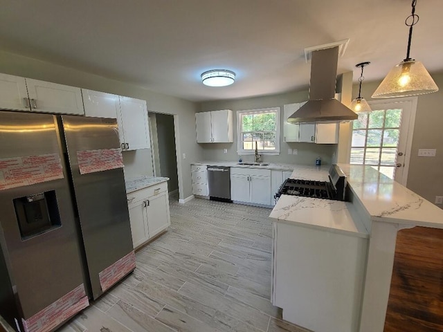 kitchen featuring island range hood, a center island, pendant lighting, stainless steel appliances, and white cabinets