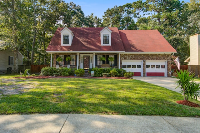 cape cod-style house featuring a garage, a front lawn, and a porch