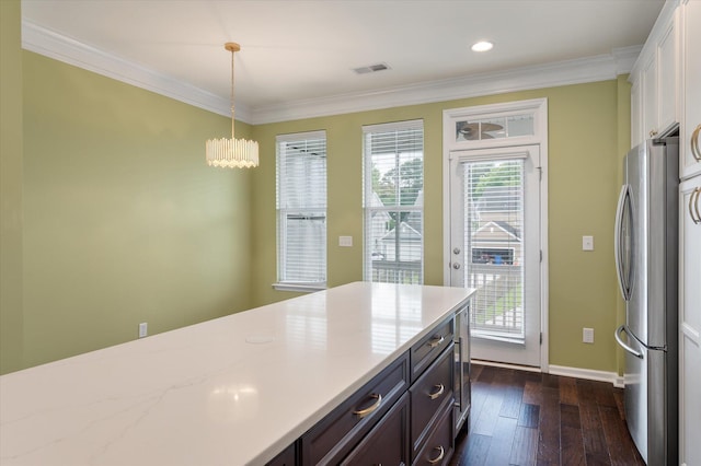 1533 Bluewater Way, Charleston, SC 29414 - kitchen with freestanding refrigerator, crown molding, dark wood-style floors, white cabinets, and baseboards