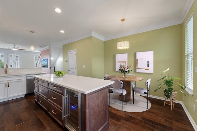 1533 Bluewater Way, Charleston, SC 29414 - kitchen with beverage cooler, dishwasher, a sink, light countertops, and white cabinets