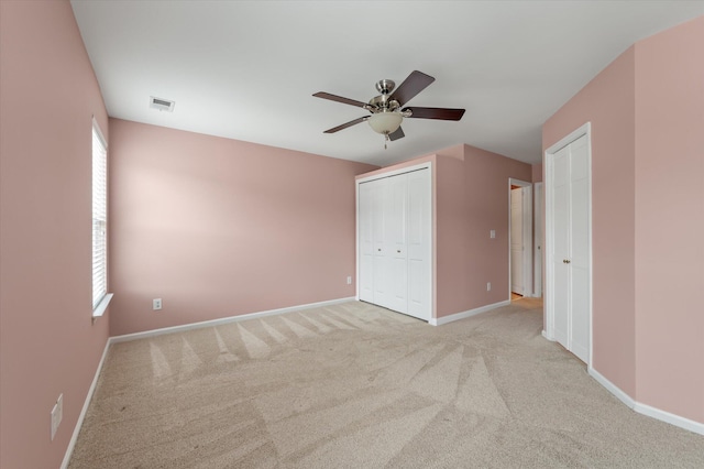 1533 Bluewater Way, Charleston, SC 29414 - unfurnished bedroom featuring light carpet, multiple windows, and baseboards