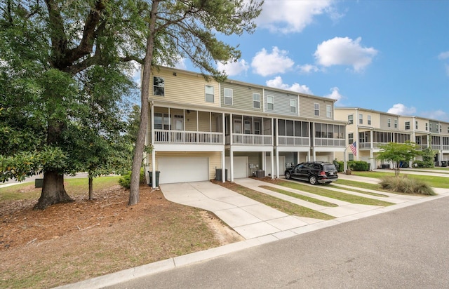 1533 Bluewater Way, Charleston, SC 29414 - view of building exterior with a garage and concrete driveway