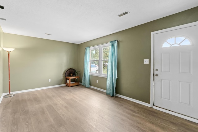7696 Brandywine Rd, North Charleston, SC 29420 - entryway with light wood-style flooring and baseboards