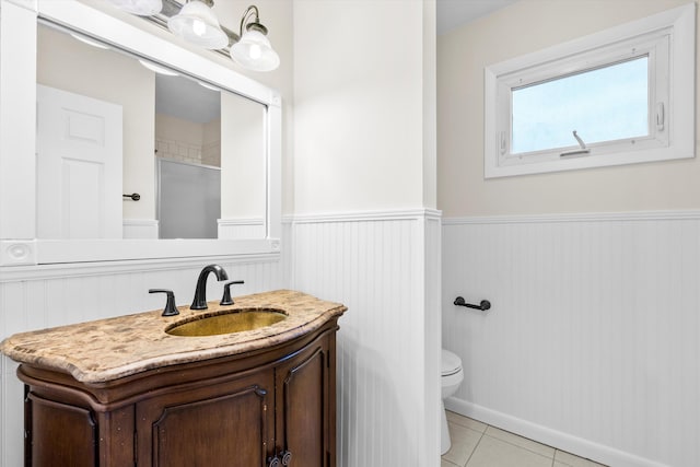 22 Ogier St, Charleston, SC 29403 - full bath with wainscoting, vanity, tile patterned floors, and a shower