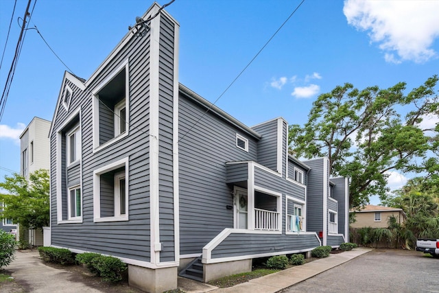 22 Ogier St, Charleston, SC 29403 - view of home's exterior featuring a chimney