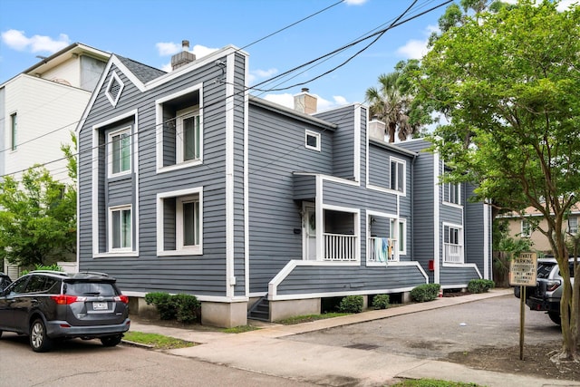 22 Ogier St, Charleston, SC 29403 - view of side of home featuring a chimney