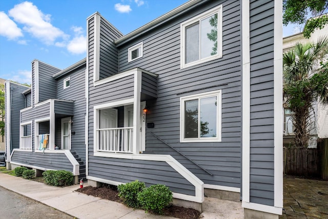22 Ogier St, Charleston, SC 29403 - view of home's exterior featuring a chimney