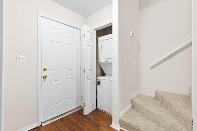 22 Ogier St, Charleston, SC 29403 - foyer featuring stacked washer / drying machine, dark wood-type flooring, and stairway