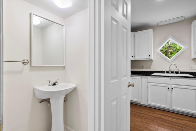22 Ogier St, Charleston, SC 29403 - bathroom featuring a sink and wood finished floors