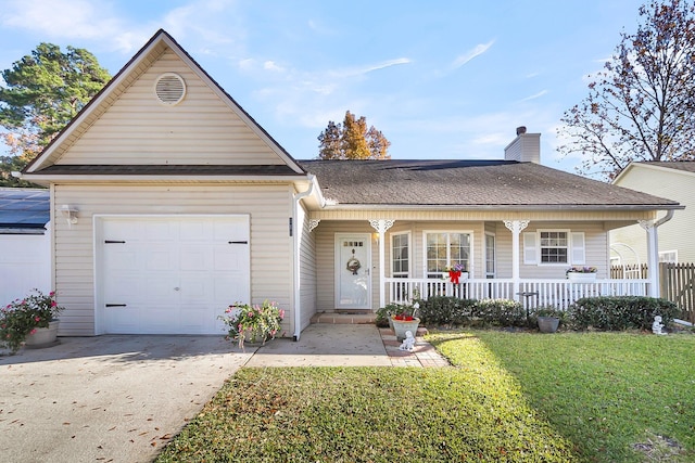 view of front facade with a front lawn, covered porch, and a garage