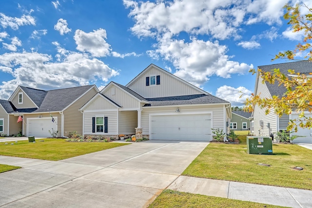 view of front of property featuring a front lawn and a garage