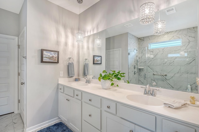 bathroom featuring vanity and a shower with shower door