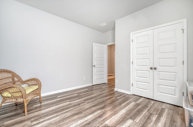 unfurnished room with hardwood / wood-style floors