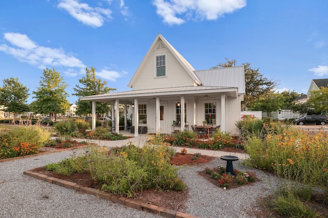 country-style home featuring covered porch