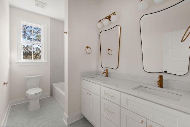 full bath with double vanity, baseboards, visible vents, and a sink