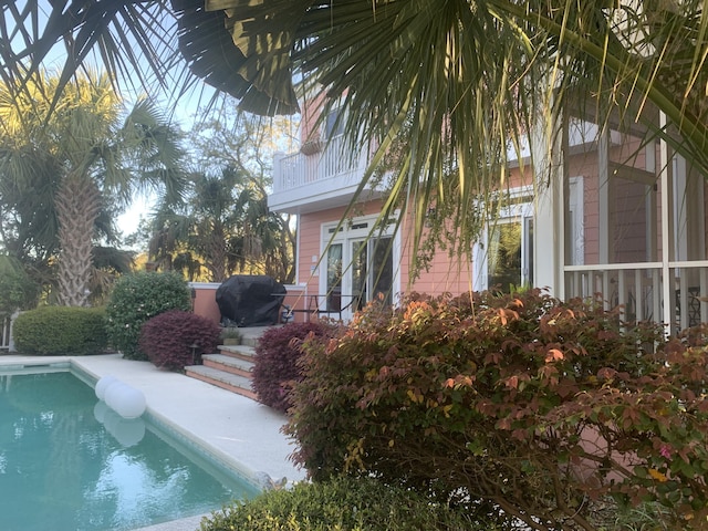 view of swimming pool with a grill