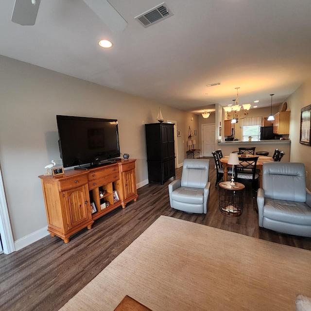 living room featuring dark hardwood / wood-style flooring