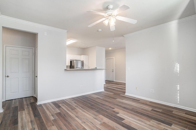 unfurnished living room with ceiling fan, dark hardwood / wood-style flooring, and crown molding