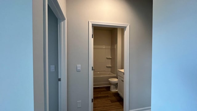 full bathroom with vanity, toilet, tub / shower combination, and wood-type flooring