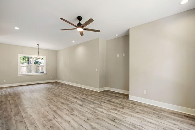 2960 Blackfish Rd, Johns Island, SC 29455 - unfurnished room featuring ceiling fan, light wood-style floors, a chandelier, baseboards, and recessed lighting