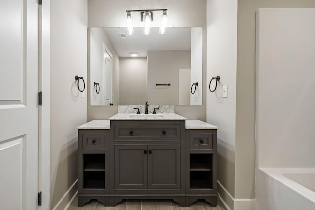 2960 Blackfish Rd, Johns Island, SC 29455 - bathroom with vanity, baseboards, and a bathtub
