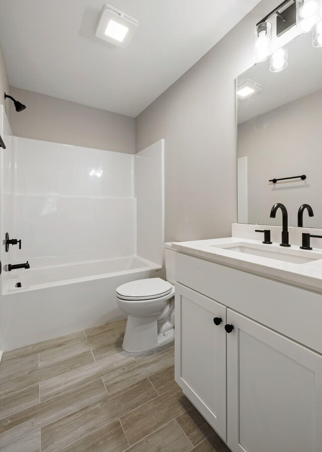 2960 Blackfish Rd, Johns Island, SC 29455 - bathroom featuring vanity, toilet, bathtub / shower combination, and wood finished floors