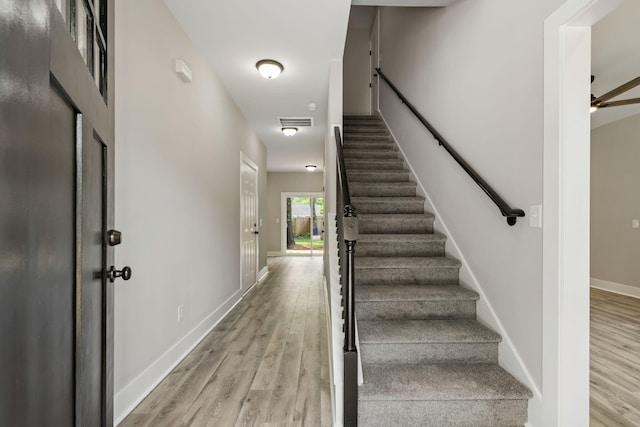 2960 Blackfish Rd, Johns Island, SC 29455 - stairway with wood finished floors, baseboards, and a ceiling fan