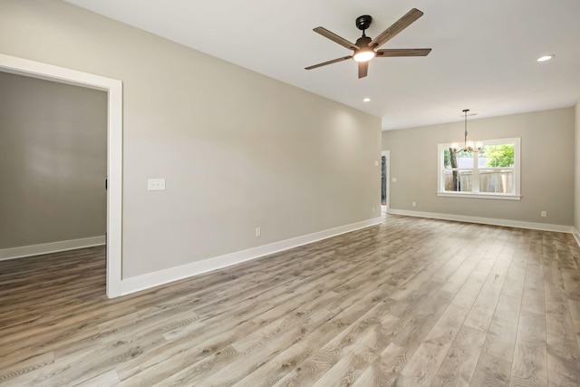 2960 Blackfish Rd, Johns Island, SC 29455 - empty room featuring a chandelier, ceiling fan, wood finished floors, recessed lighting, and baseboards