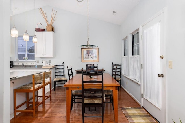 1578 Harborsun Dr, Charleston, SC 29412 - dining area featuring lofted ceiling, visible vents, and wood finished floors