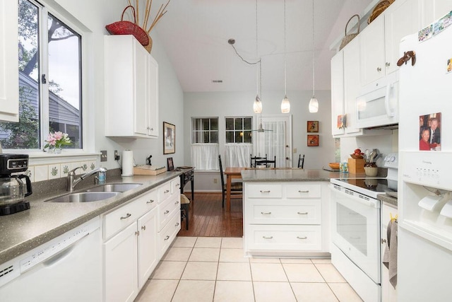 1578 Harborsun Dr, Charleston, SC 29412 - kitchen featuring a peninsula, a wealth of natural light, a sink, and white appliances