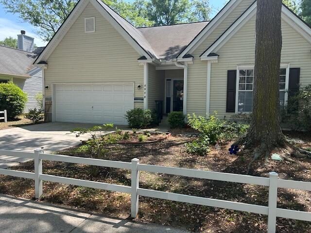 1578 Harborsun Dr, Charleston, SC 29412 - view of front facade with a garage, a fenced front yard, and driveway