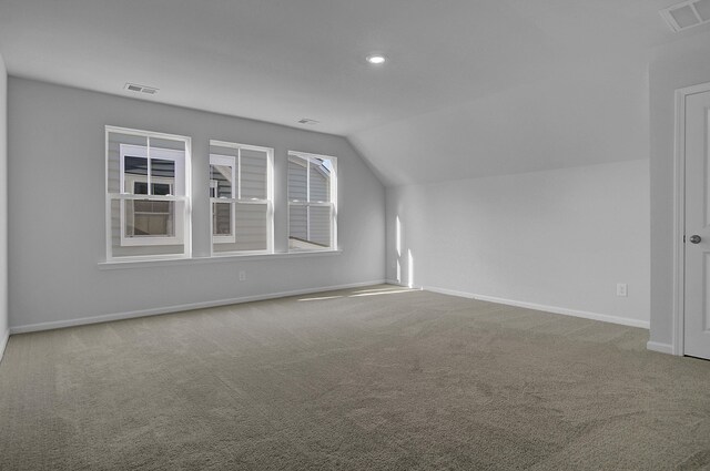 bonus room featuring lofted ceiling, carpet floors, baseboards, and recessed lighting