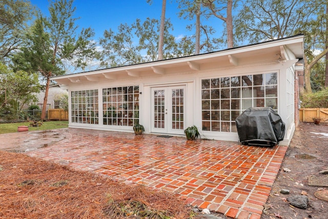 rear view of house featuring french doors and a patio