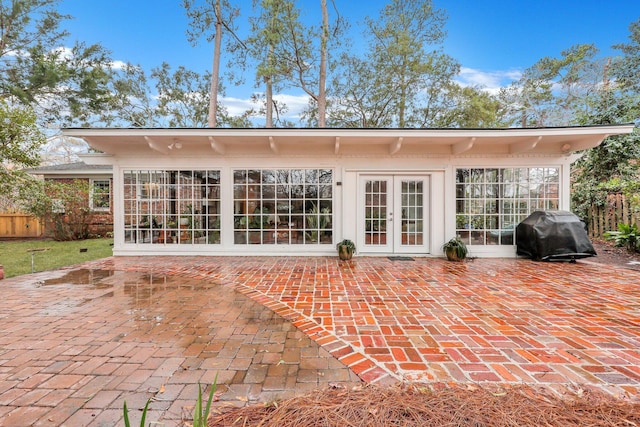 back of house featuring a patio area and french doors