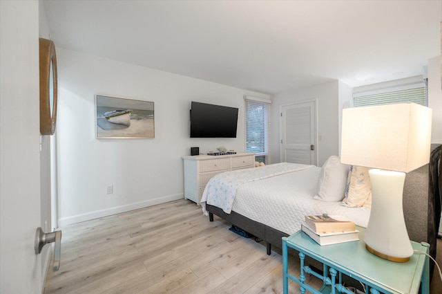 bedroom with light hardwood / wood-style flooring