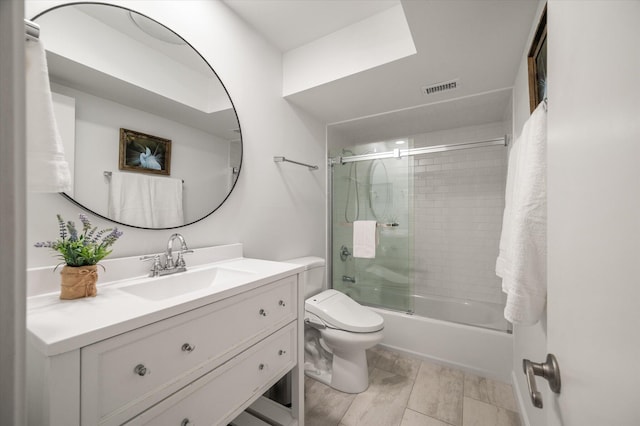 full bathroom with vanity, toilet, and enclosed tub / shower combo