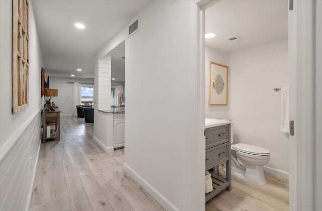 corridor featuring light hardwood / wood-style flooring