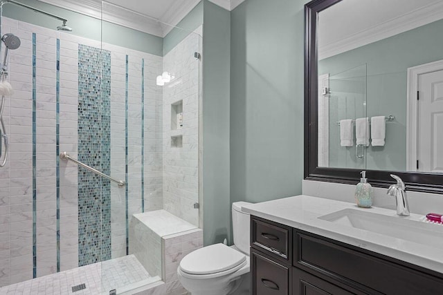 full bathroom featuring a stall shower, toilet, vanity, and ornamental molding