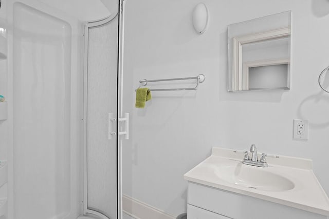 full bathroom featuring vanity and an enclosed shower