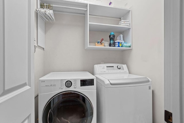 laundry area featuring laundry area and washer and clothes dryer