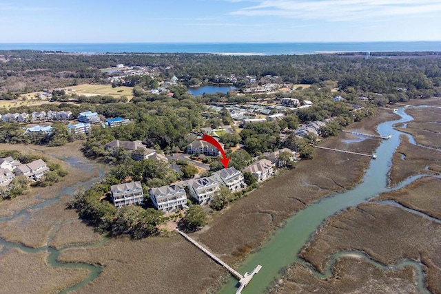 birds eye view of property featuring a water view