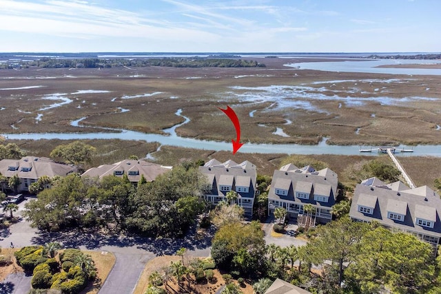 drone / aerial view with a water view and a residential view