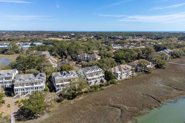 bird's eye view with a residential view and a water view