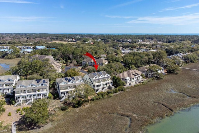 bird's eye view featuring a residential view and a water view