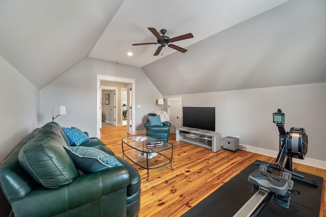 living area with light wood-style flooring, baseboards, vaulted ceiling, and a ceiling fan