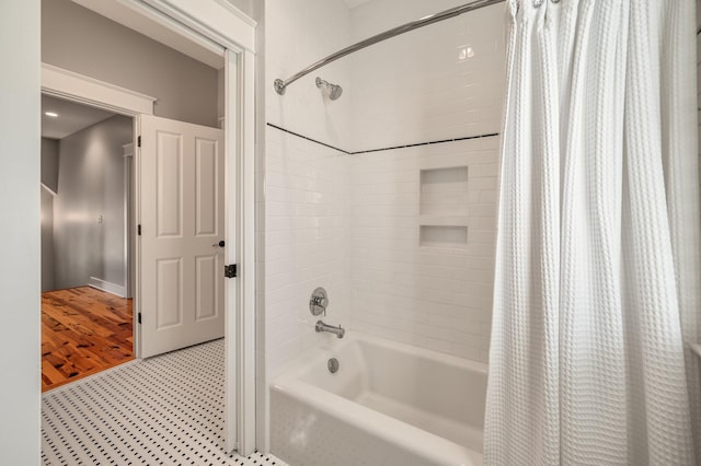 full bathroom with shower / bath combo