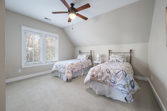 bedroom with carpet, visible vents, vaulted ceiling, and baseboards