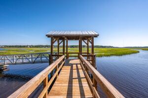 dock area with a gazebo and a water view